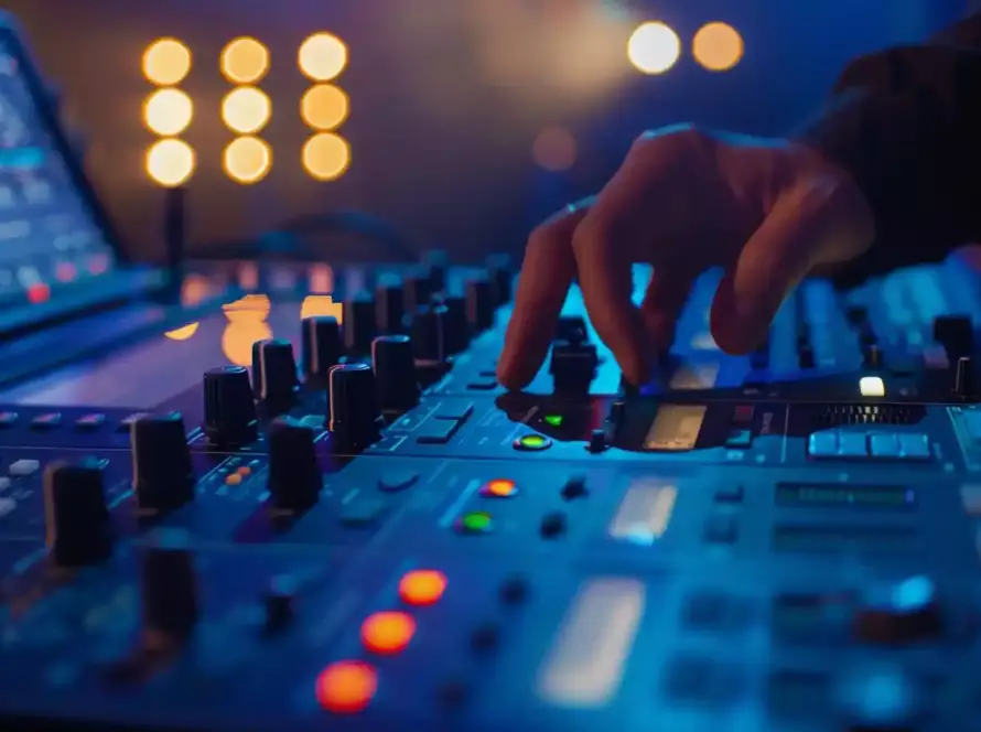 Close-up of professional DJ mixer with blue lighting and illuminated controls at Hunter Valley wedding